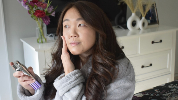 Image contains an Allure editor applying Lancôme Rnergie H.C.F. Triple Serum